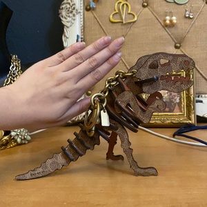 Coach Rexy dinosaur keychain